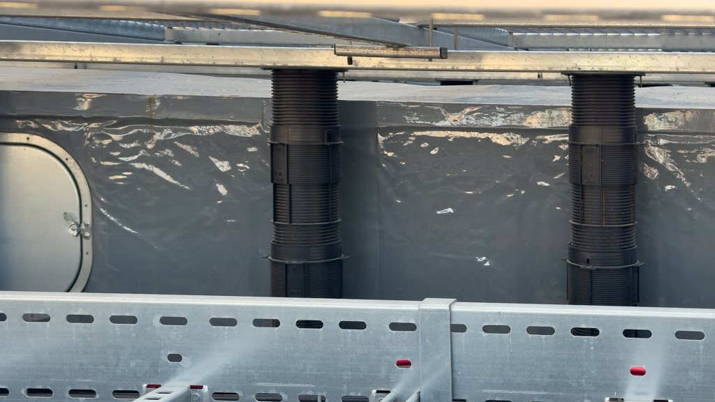 Buzon pedestals supporting GRP grating on the roof of 76 Southbank